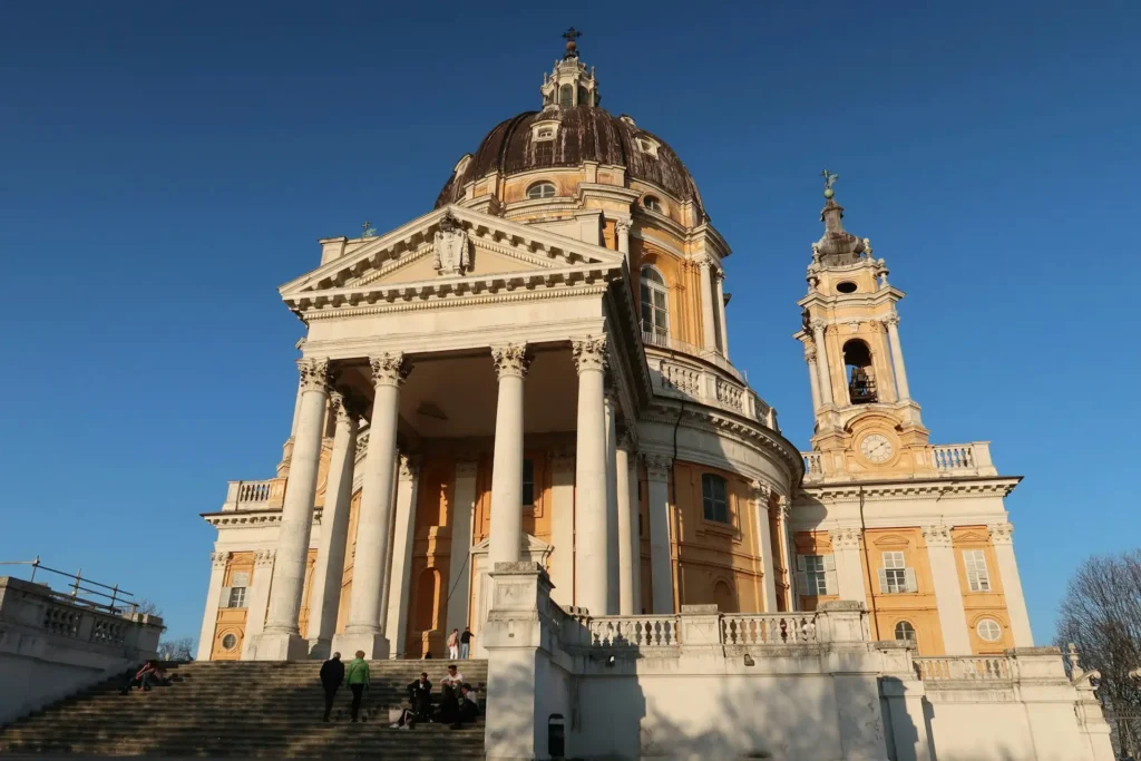 Pictured is the Basilica of Superga on a sunny day, with blue sky